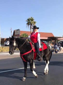 woman on horse in street parade